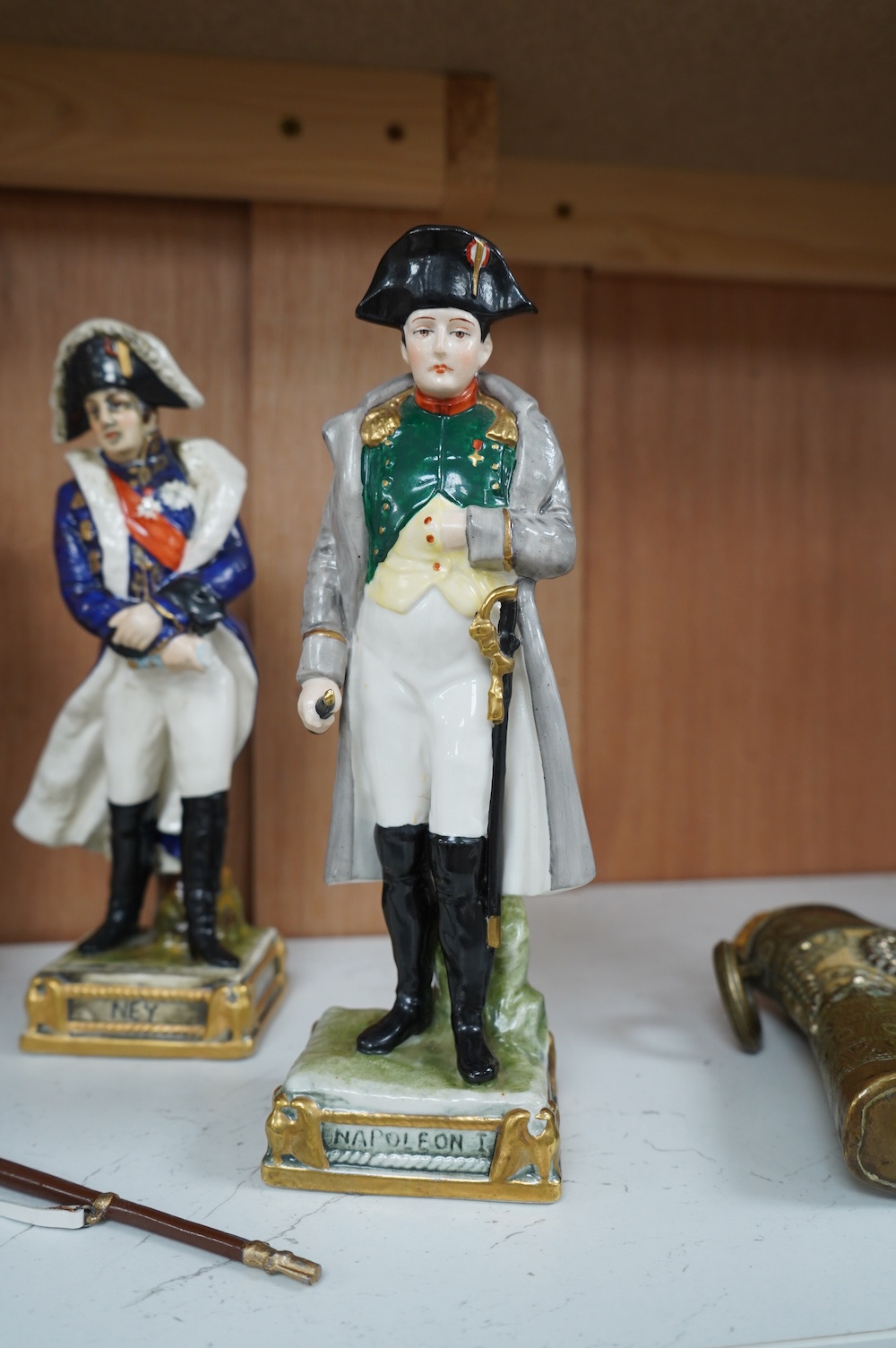 Four Continental porcelain figures wearing military dress including Napoleon and Officer, 45th Foot, largest 23cm high. Condition - good